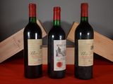 three bottles of wine sitting next to each other on a table