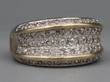 an image of a diamond ring on a gray surface