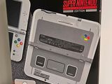 a box with a nintendo 3ds and a game controller in it