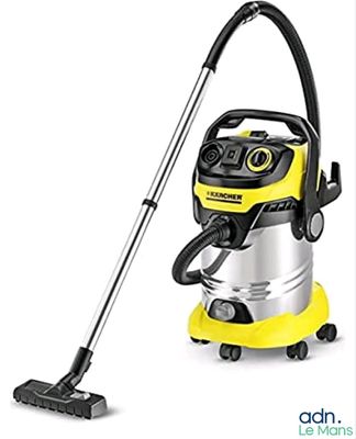 un aspirateur jaune et noir muni d'une poignée noire