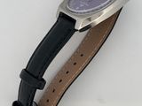 an image of a wrist watch with a purple dial on a black leather strap