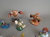 many figurines of different types and sizes on the table