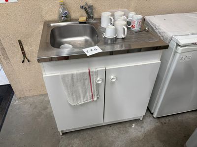 a small kitchen with a sink and a dishwasher