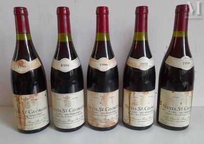 six bottles of wine are lined up in a row on a table