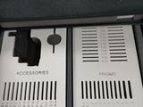 two electronic devices in a case on the floor