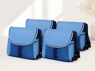three blue and black bags sitting on top of a white table