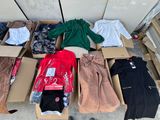 a lot of clothes that are sitting in a box
