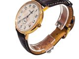 a close up of a wrist watch with a black leather band