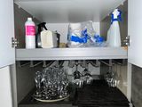 a cabinet with a lot of dishes and glasses in it