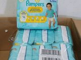 a box of diapers sitting on top of a cardboard box