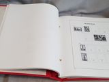 an open book that is sitting on a bed