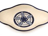 a blue and white plate with a design on it