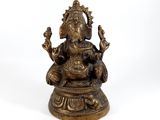 an image of a bronze statue of an elephant sitting on a pedestal