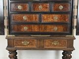 an image of a very old wooden cabinet with many drawers
