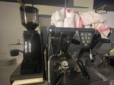 a black coffee machine sitting on a counter in a kitchen