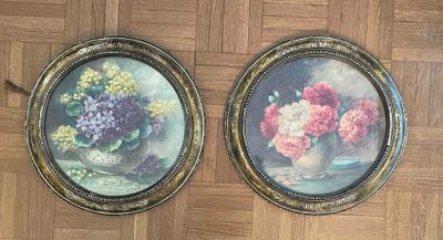 two paintings of flowers in a vase on the floor