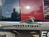 a close up of a license plate on a red truck