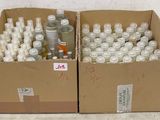 many bottles of alcohol in a box on the floor