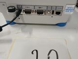 a picture of a computer on a table with a number on it