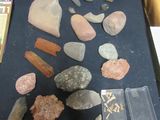 a table with a bunch of rocks and other items on it