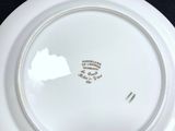 a white plate that has a picture of a horse on it