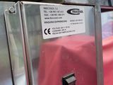 a metal box with a red cloth on it