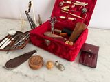 a red case filled with various tools on a table