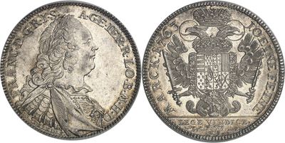 a silver coin with an eagle on the front and a crown on the back