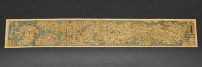 an old map of the world is hanging on a wall