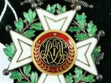 an image of a badge with a crown on top of it