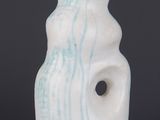 an image of a white lamp with a blue swirl on it