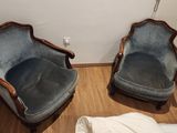 two chairs that are next to each other on the floor