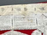 a red and white cloth with a picture of a man on it