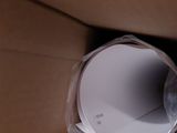 a cardboard box with a roll of paper inside of it