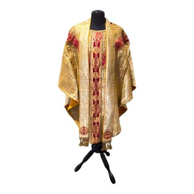 an image of a gold and red dress on a mannequin stand