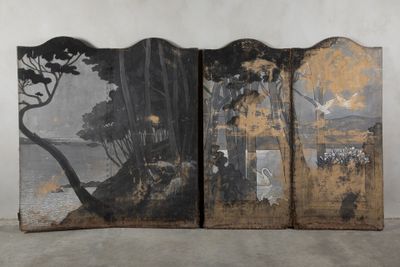 three panels with a painting of trees on them in front of a white wall