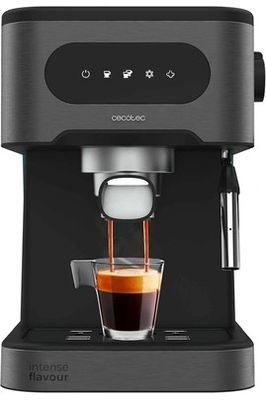 a black coffee maker with a cup of coffee in front of it