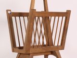 a wooden magazine rack with a magazine holder on it
