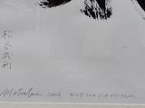 a black and white drawing of a bird on a piece of paper