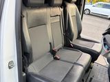 two seats in the back of a white van