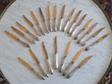 a lot of knives that are sitting on a table