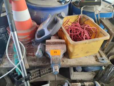 a pile of construction materials and tools on a table