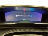 a picture of a car dashboard with a digital display