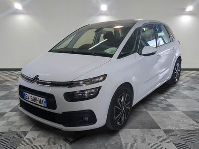 the white citrole is parked on a checkered floor