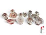 many different types of glass dishes on a white surface