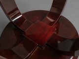 an image of a sculpture of a wooden object on a gray surface