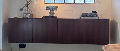an image of a living room with a table and a lamp