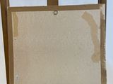 an easel with a painting on top of it in front of a white background
