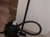a vacuum that is sitting on the floor next to the stairs