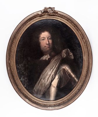 portrait of a man in armor in a gold oval frame